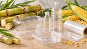 Şeker kamışı ve mısır yanında şeffaf plastik ambalaj örneklerini gösteren temsili düzenleme