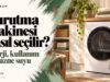 Kurutma makinesi nasıl seçilir başlığı yanında ahşap tezgâh altında beyaz bir kurutucu ve katlanmış havlular.